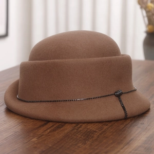 Detailed texture of dark brown wool felt hat featuring a delicate crystal chain accent