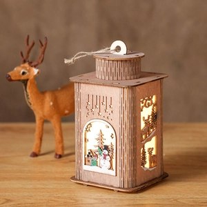 Wooden Christmas lantern decoration with warm LED lights and laser-cut winter scenes