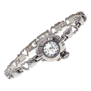Detailed close-up of a silver quartz watch with hollow heart-shaped metal link strap