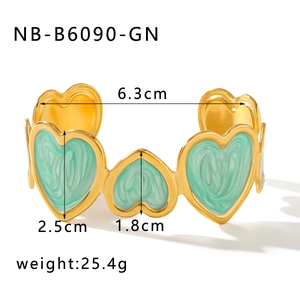 Detail view of gold heart enamel bracelet with dimensions 6.3cm inner diameter and 25.4g weight
