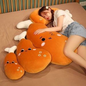 Model sleeping with cute cartoon fried chicken leg plush pillows of various sizes
