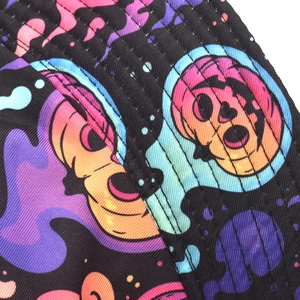 Macro shot of twill fabric detail with pop art skull prints and heavy-duty stitching