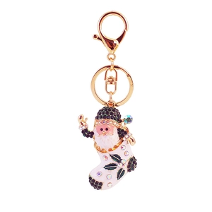 Golden Santa Claus boot keychain with colorful rhinestones and white enamel details
