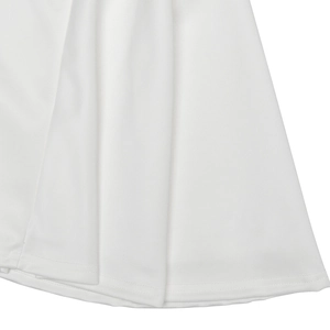 Detailed close-up of white ruched fabric hem on a summer sleeveless mini dress
