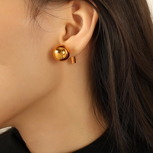Minimalist high-polished 18k gold plated stainless steel ball stud earrings on ear