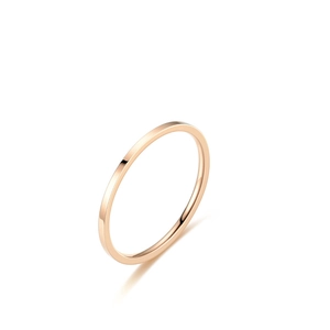 Detailed side view of slim rose gold titanium steel ring band with polished finish