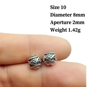 Detailed macro of 8mm vintage Tibetan silver flower beads for jewelry making