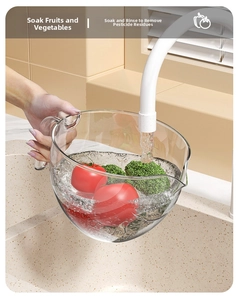 Kitchen drain basket bowl with handle washing fresh vegetables in a sink