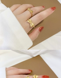 Detail of 18K gold plated bow rings showing matte texture and elegant feminine design