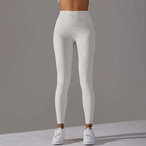 Close-up of white high-waisted yoga pants with peach lift effect and buttery soft fabric