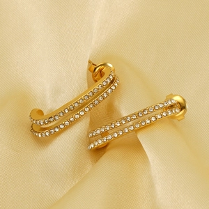 Elegant gold double-layered U-shaped earrings with sparkling cubic zirconia on silk