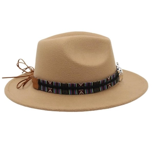 Detail of camel wool fedora hat featuring ethnic patterned band and leather tassels