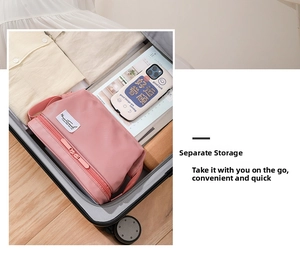 Pink double-layer travel toiletry bag inside a suitcase for organized storage