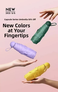 Compact five-fold capsule umbrella held in hand to show lightweight and mini size
