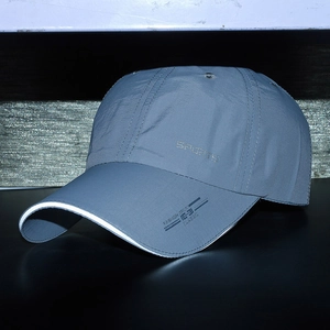 Grey quick-dry sports baseball cap with reflective trim and side SPORTS lettering