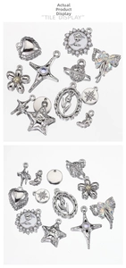 Detailed assortment of vintage silver charms including heart, cross, and rose designs