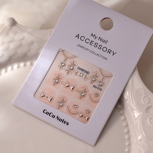 Detail of MJ-015 3D embossed nail art stickers with rhinestones and gold bow designs