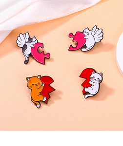 Set of four cartoon cat enamel pins featuring kittens with heart shapes and puzzle pieces