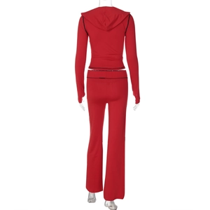 Rear view of red hooded two-piece tracksuit with black contrast stitching for women