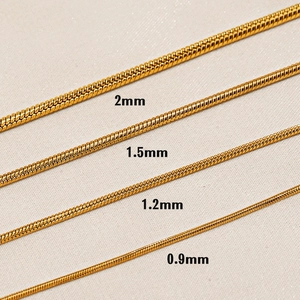 Gold stainless steel snake bone chains shown in 0.9mm to 2mm width variations