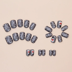 24-piece Christmas press-on nails with black glitter, snowman patterns and white snowflakes