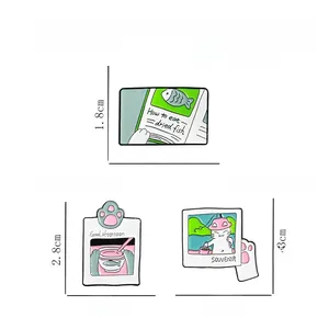 Detailed view of cat fishing enamel pins in alloy metal with dimensions and weight