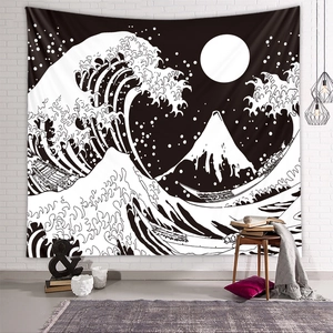 Detailed view of Great Wave tapestry hung on a white brick wall in a modern living room