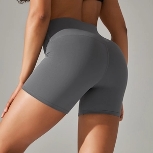 Close-up of high-waist yoga shorts showing the sculpting seam and stretch fabric
