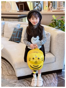 Detail of yellow tiger hard shell kids backpack with cute 3D ears and durable double zipper