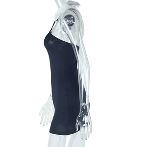 Side view of black backless bodycon dress with white halter neck collar and mini length