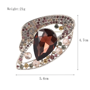 European vintage alloy brooch with large brown teardrop gemstone and multicolored rhinestones