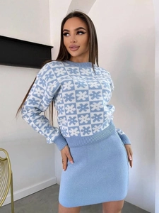Close-up of Fair Isle knit sweater and mini skirt set in light blue and white