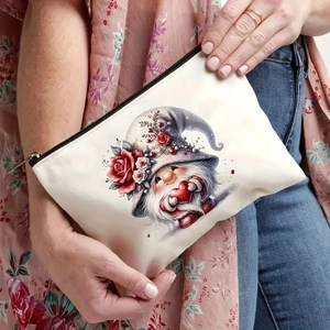White canvas gnome cosmetic bag with rose heart print held by a model in casual style