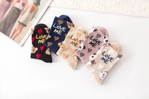 Detailed fan-shaped arrangement of five colorful cartoon cotton socks with bear and heart patterns