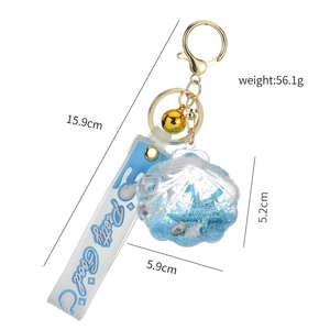 Blue acrylic shell keychain with floating glitter and seahorse, 56.1g beach charm accessory