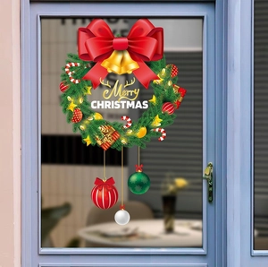 Detailed Christmas wreath window sticker with red bow, gold bells, and hanging ornaments
