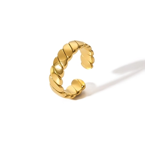 Polished gold twisted geometric open ring with textured diagonal stripes on white background