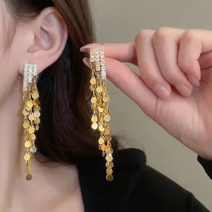 Elegant gold long fringe earrings with sparkling cubic zirconia and shimmering sequins