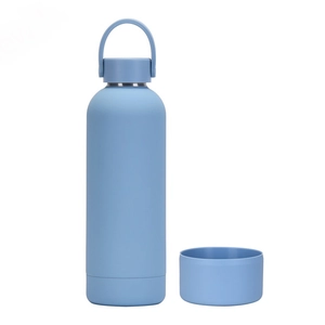 Macro detail of a light blue matte stainless steel water bottle with its silicone base cover