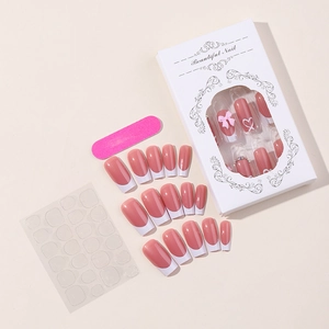 Pink French press-on nails with bows and hearts including glue and file in a box