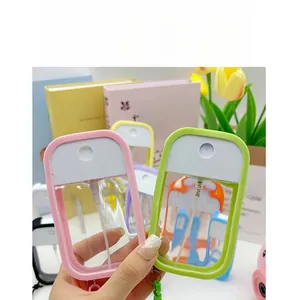 Handheld view of a portable flat macaron spray bottle for travel and perfume