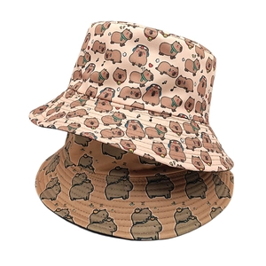 Double-sided capybara print bucket hat set in light apricot and brown canvas material