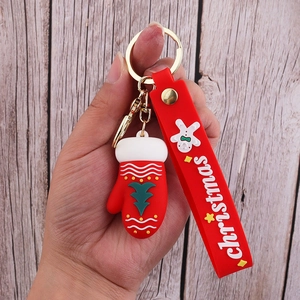 Close-up of a red Christmas glove keychain with gingerbread man silicone wristband