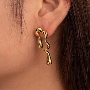 Minimalist liquid metal gold drop earrings with irregular molten fluid design for women
