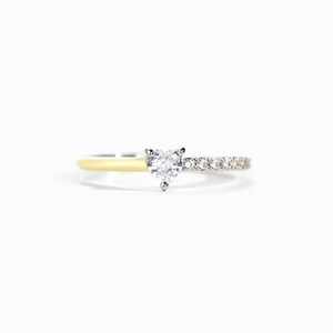 Macro shot of two-tone S925 silver ring featuring heart-cut zircon and pavé setting