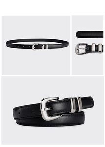 Detail view of a black leather belt for women featuring a polished silver metal buckle