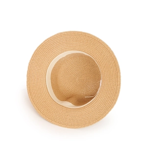 Close-up of woven straw sun hat interior showing the adjustable sweatband and texture