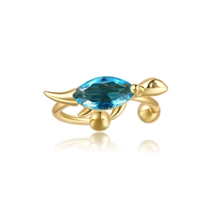 Detail of 18K gold-plated turtle ear cuff featuring a sparkling blue marquise gemstone