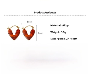 Détails des boucles d'oreilles cœur rouge marbré, bordure dorée et fiche technique 6,9g