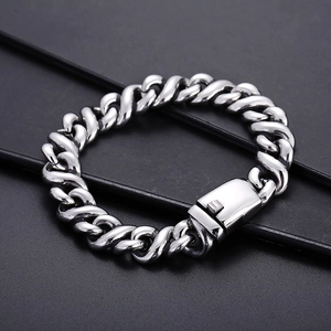 Detail of silver stainless steel Cuban link bracelet with hydraulic figure-8 clasp design